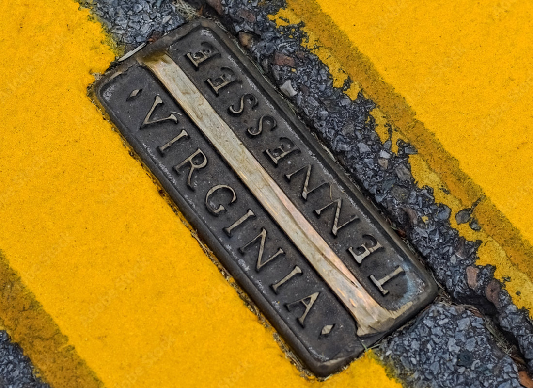 About Our Agency - Close-up of a Nameplate on the Ground